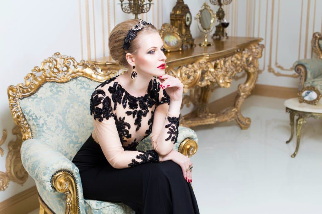Gold-plated armchairs are crafted with an attention to detail